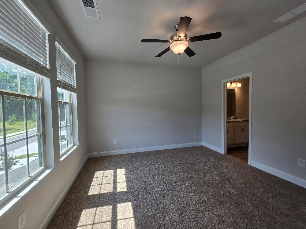 6194 Ripple Way, Unit 86 Atlanta, GA 30349 - Photo 15 of 27 wooden floor in an empty room with a window