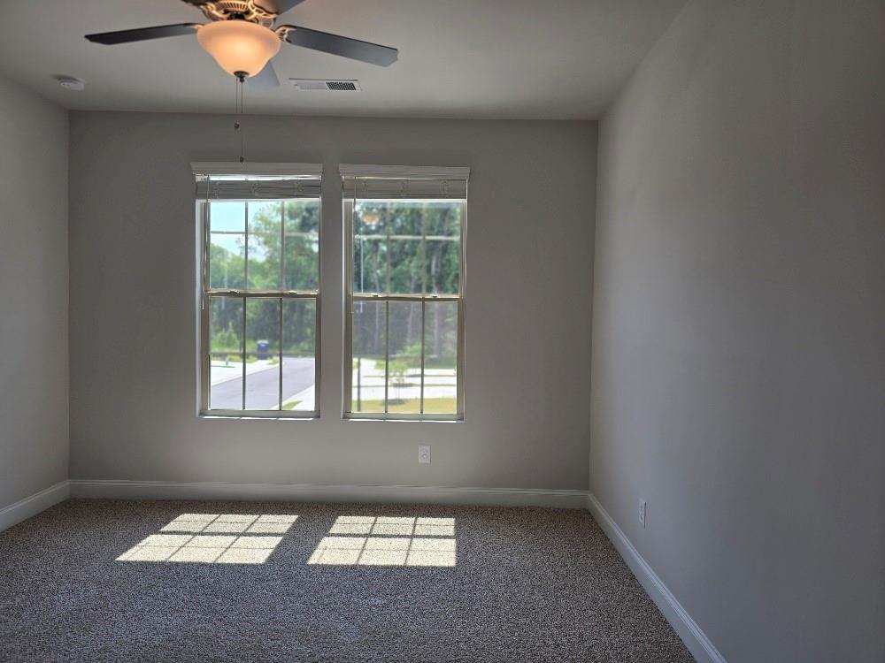 6194 Ripple Way, Unit 86 Atlanta, GA 30349 - Photo 18 of 27 an empty room with a window