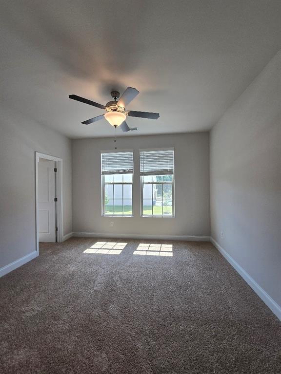 6194 Ripple Way, Unit 86 Atlanta, GA 30349 - Photo 19 of 27 a view of an empty room with a window