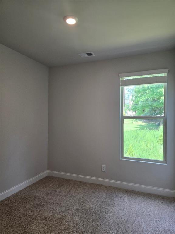 6194 Ripple Way, Unit 86 Atlanta, GA 30349 - Photo 24 of 27 an empty room with a window