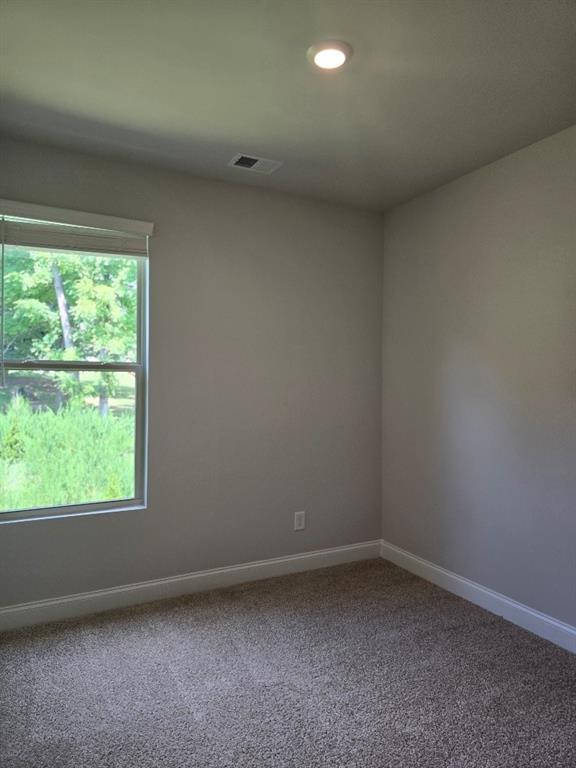 6194 Ripple Way, Unit 86 Atlanta, GA 30349 - Photo 25 of 27 a view of a room that has a window in it