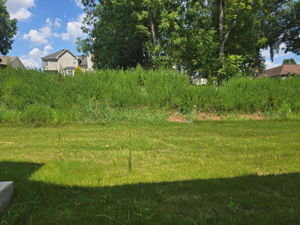 6194 Ripple Way, Unit 86 Atlanta, GA 30349 - Photo 27 of 27 a view of a golf course with a lake