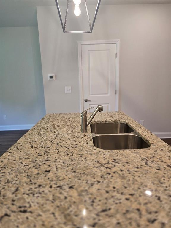 6194 Ripple Way, Unit 86 Atlanta, GA 30349 - Photo 8 of 27 a bathroom with a sink and a mirror