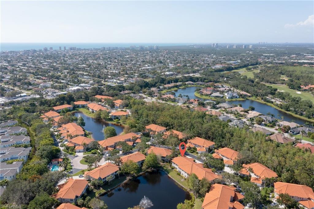 1072 Egrets Walk Circle, Unit 104 Naples, FL 34108 - Photo 30 of 37 an aerial view of multiple house