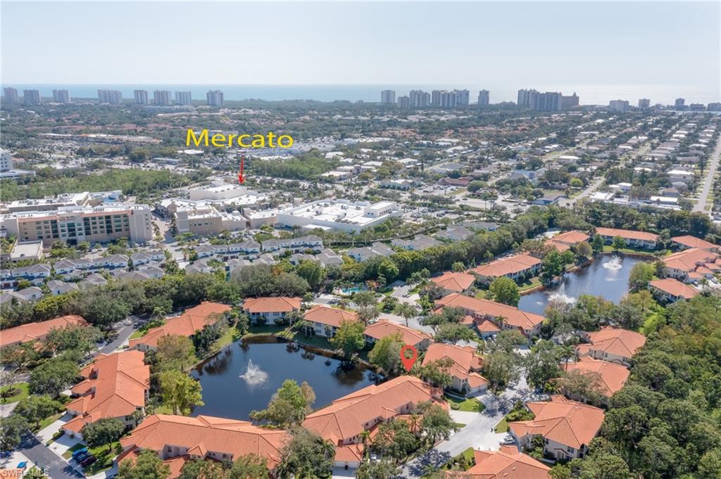 1072 Egrets Walk Circle, Unit 104 Naples, FL 34108 - Photo 31 of 37 an aerial view of residential houses with outdoor space