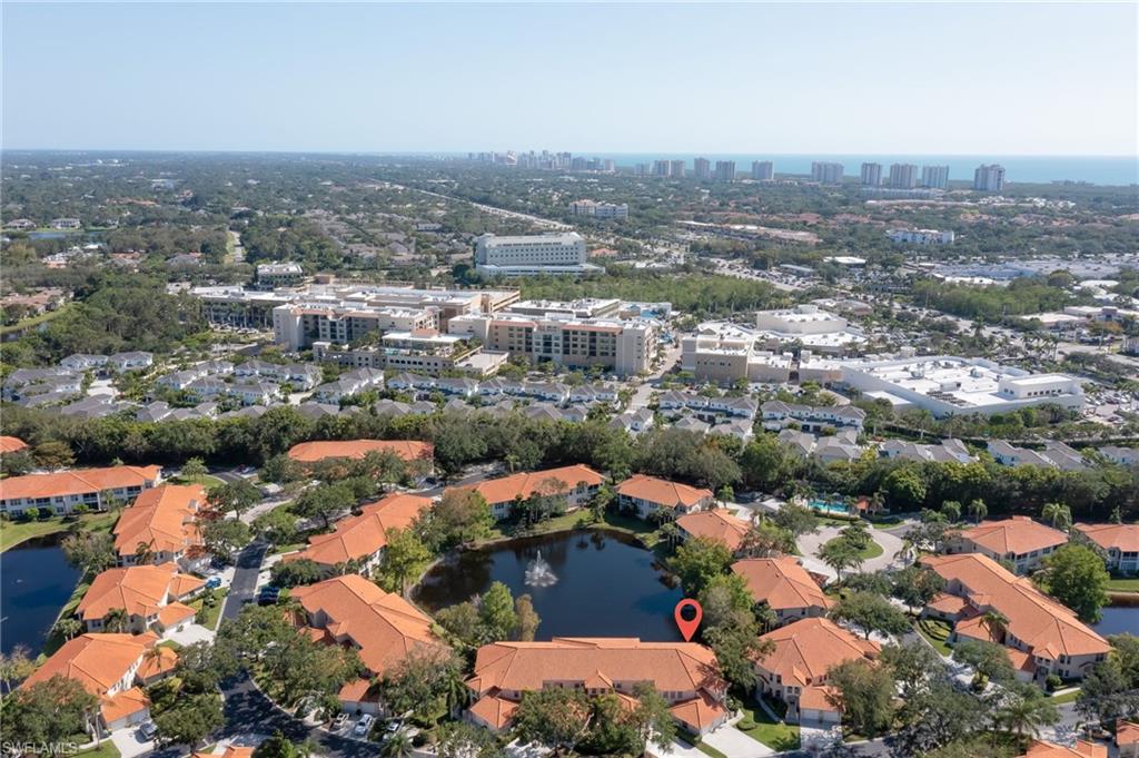 1072 Egrets Walk Circle, Unit 104 Naples, FL 34108 - Photo 32 of 37 an aerial view of residential houses with outdoor space