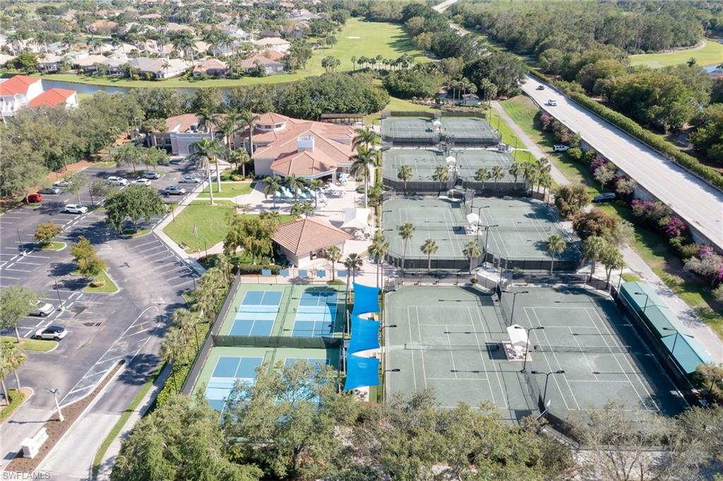 1072 Egrets Walk Circle, Unit 104 Naples, FL 34108 - Photo 33 of 37 an aerial view of residential houses with outdoor space