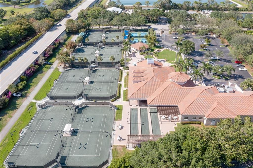 1072 Egrets Walk Circle, Unit 104 Naples, FL 34108 - Photo 34 of 37 an aerial view of residential houses with outdoor space