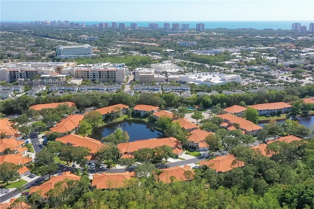1072 Egrets Walk Circle, Unit 104 Naples, FL 34108 - Photo 36 of 37 an aerial view of residential houses with outdoor space