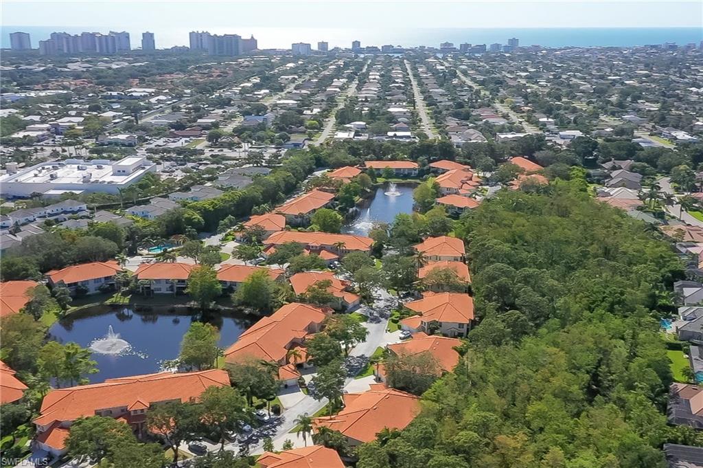 1072 Egrets Walk Circle, Unit 104 Naples, FL 34108 - Photo 37 of 37 an aerial view of multiple house