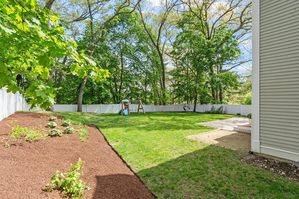 56 Old Marlboro Road Concord, MA 01742 - Photo 23 of 34 a view of a garden with a tree