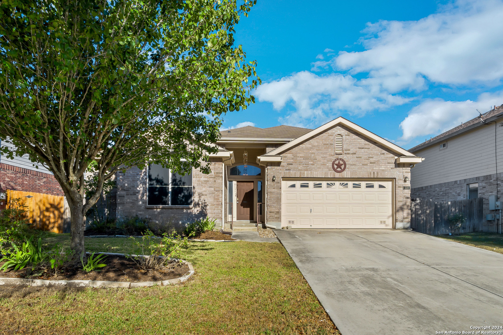 225 Crimson Tree Cibolo, TX 78108 - Photo 1 of 34 a front view of a house with garden
