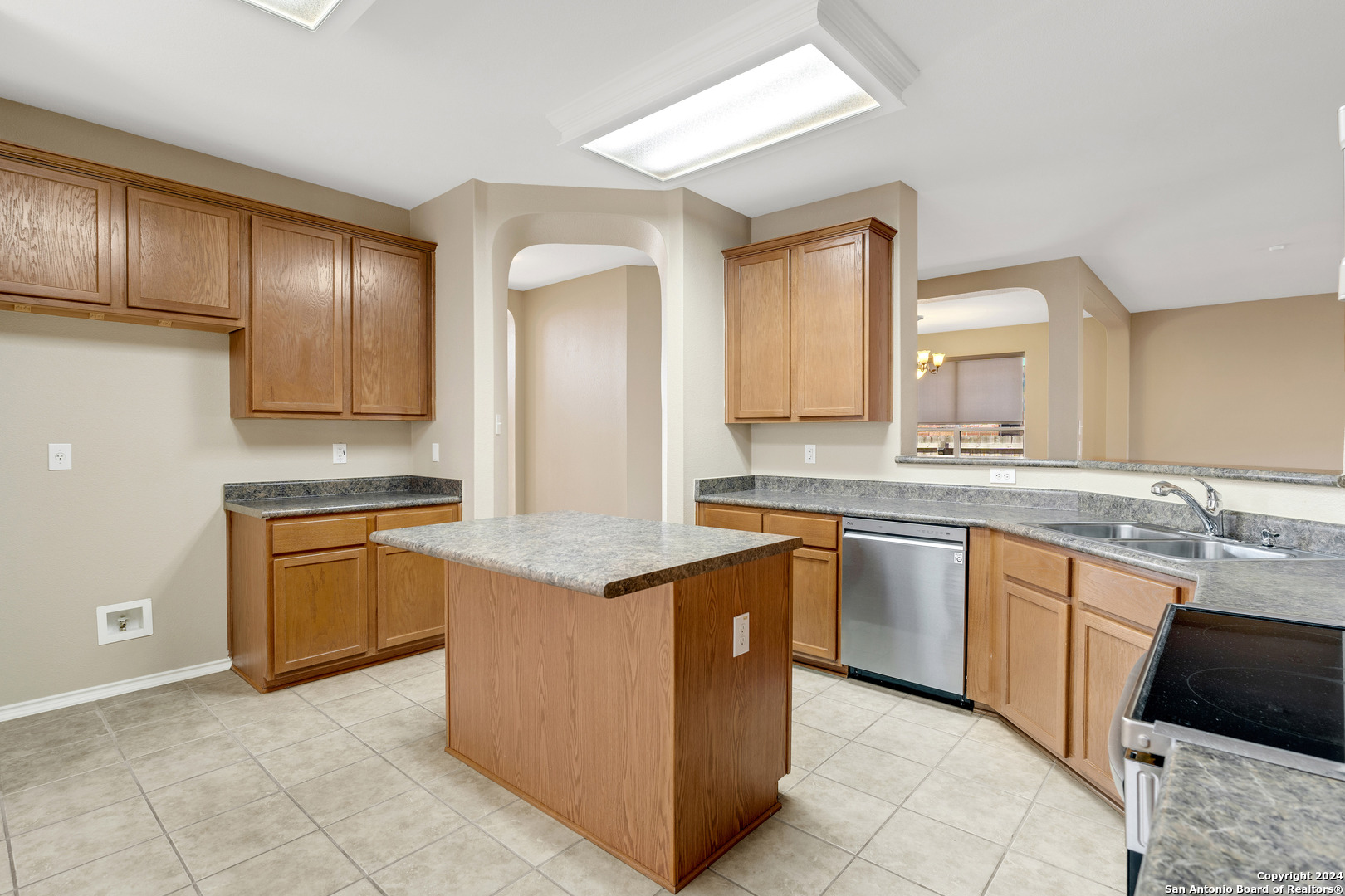 225 Crimson Tree Cibolo, TX 78108 - Photo 11 of 34 a kitchen with stainless steel appliances granite countertop wooden cabinets a sink and dishwasher