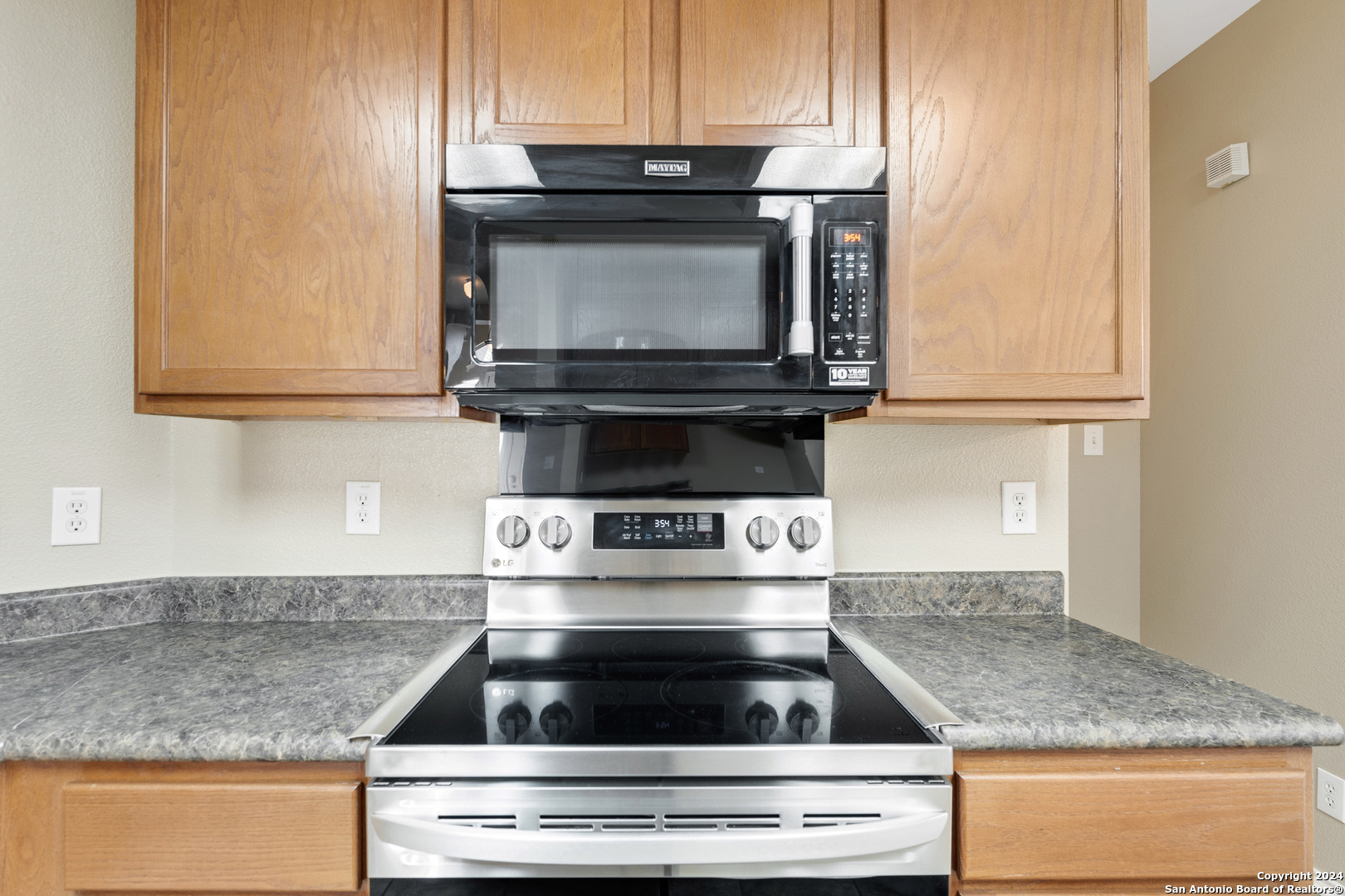 225 Crimson Tree Cibolo, TX 78108 - Photo 14 of 34 a stove top oven sitting inside of a kitchen