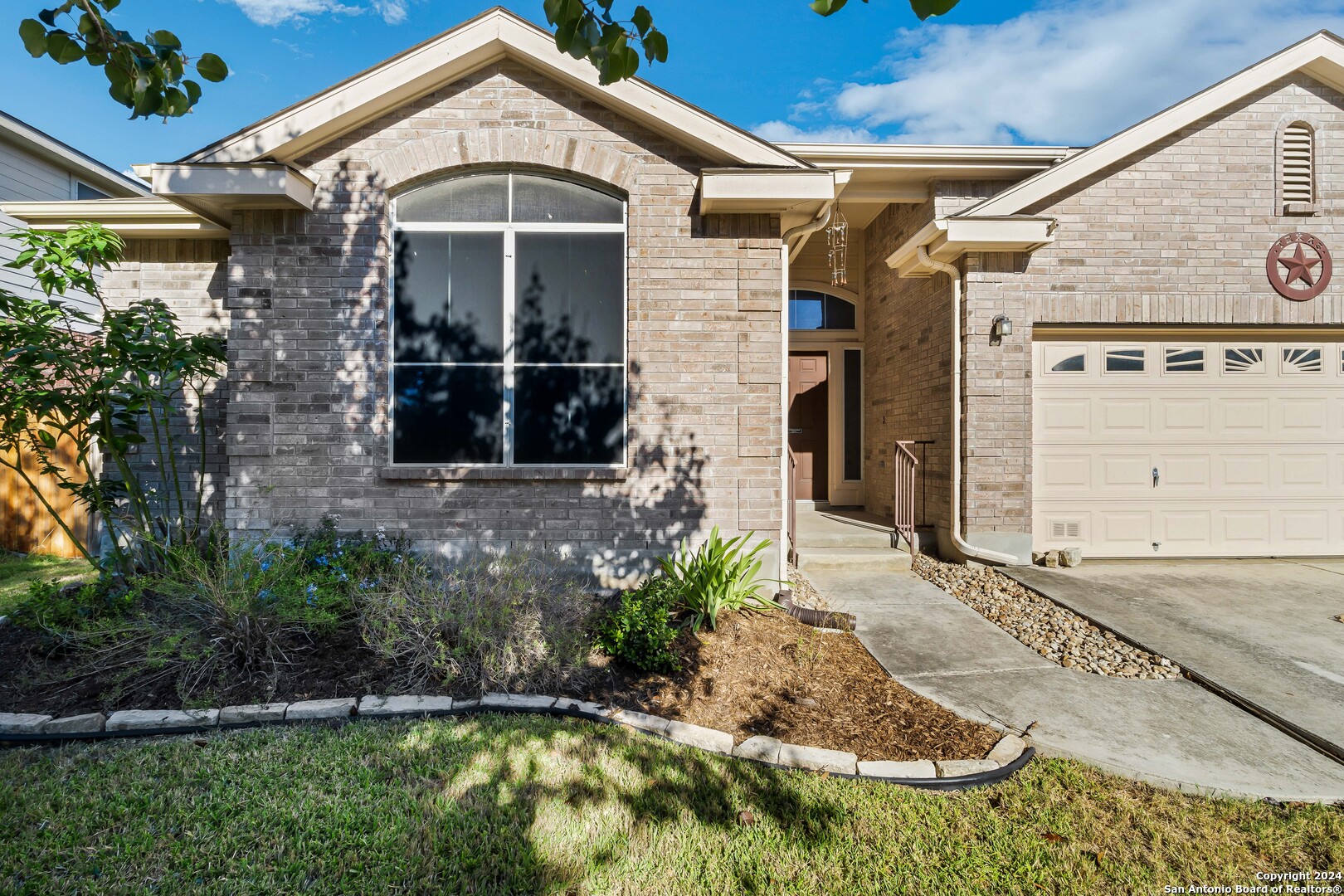 225 Crimson Tree Cibolo, TX 78108 - Photo 2 of 34 a front view of a house with a yard