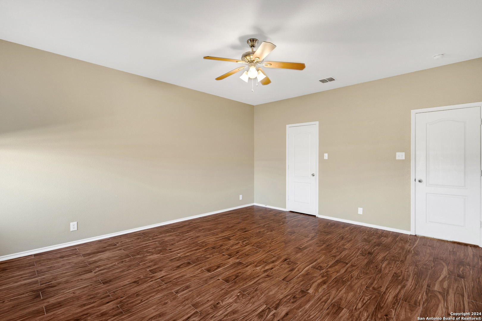 225 Crimson Tree Cibolo, TX 78108 - Photo 22 of 34 a view of an empty room with wooden floor