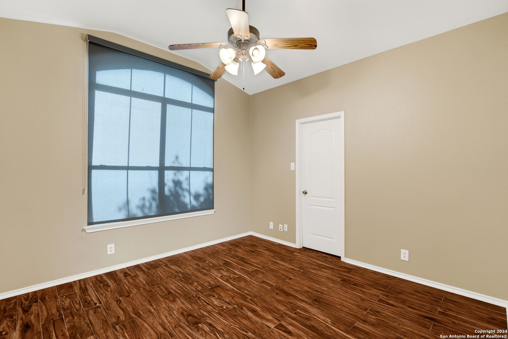 225 Crimson Tree Cibolo, TX 78108 - Photo 27 of 34 an empty room with wooden floor and windows