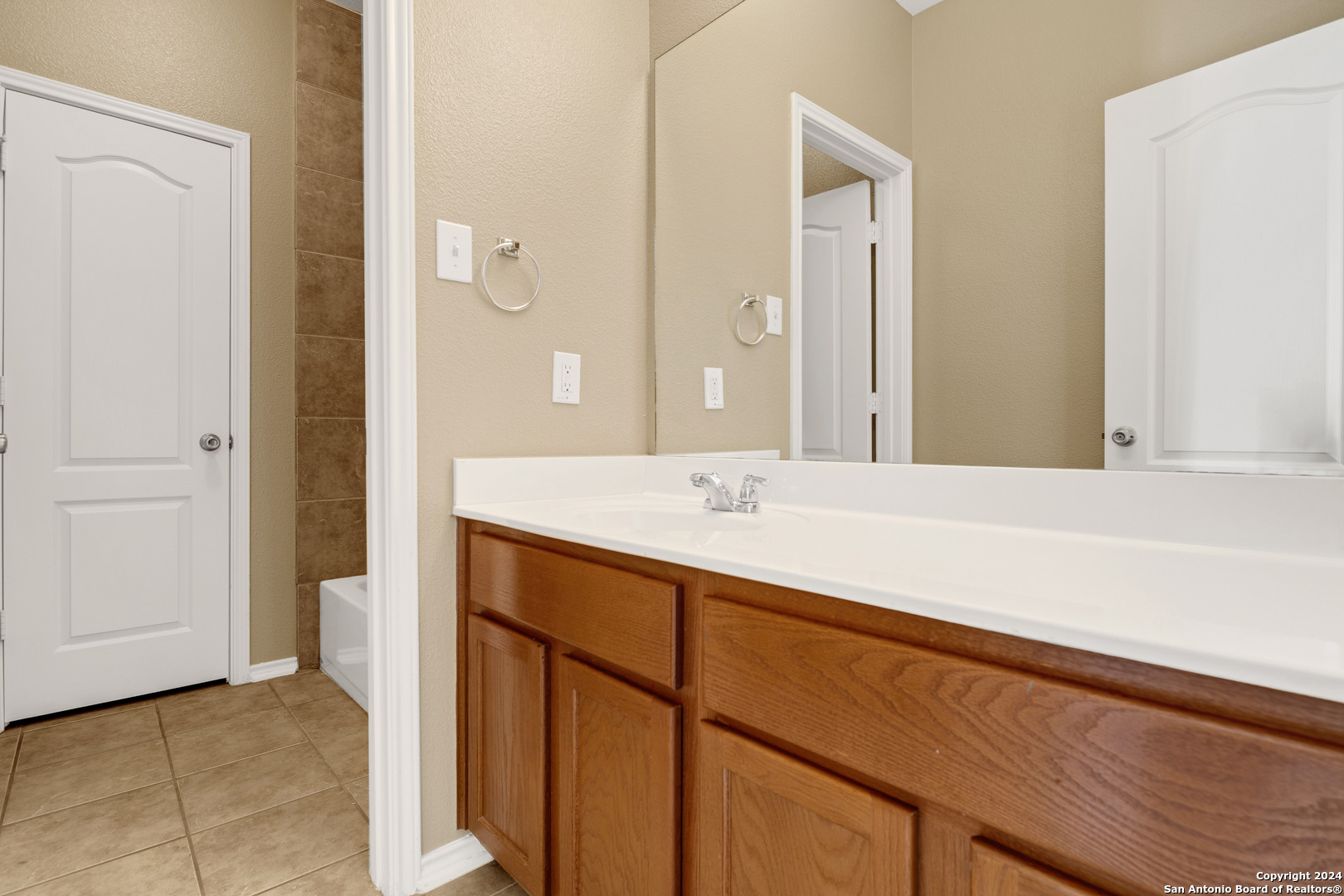 225 Crimson Tree Cibolo, TX 78108 - Photo 28 of 34 a bathroom with a sink and a mirror