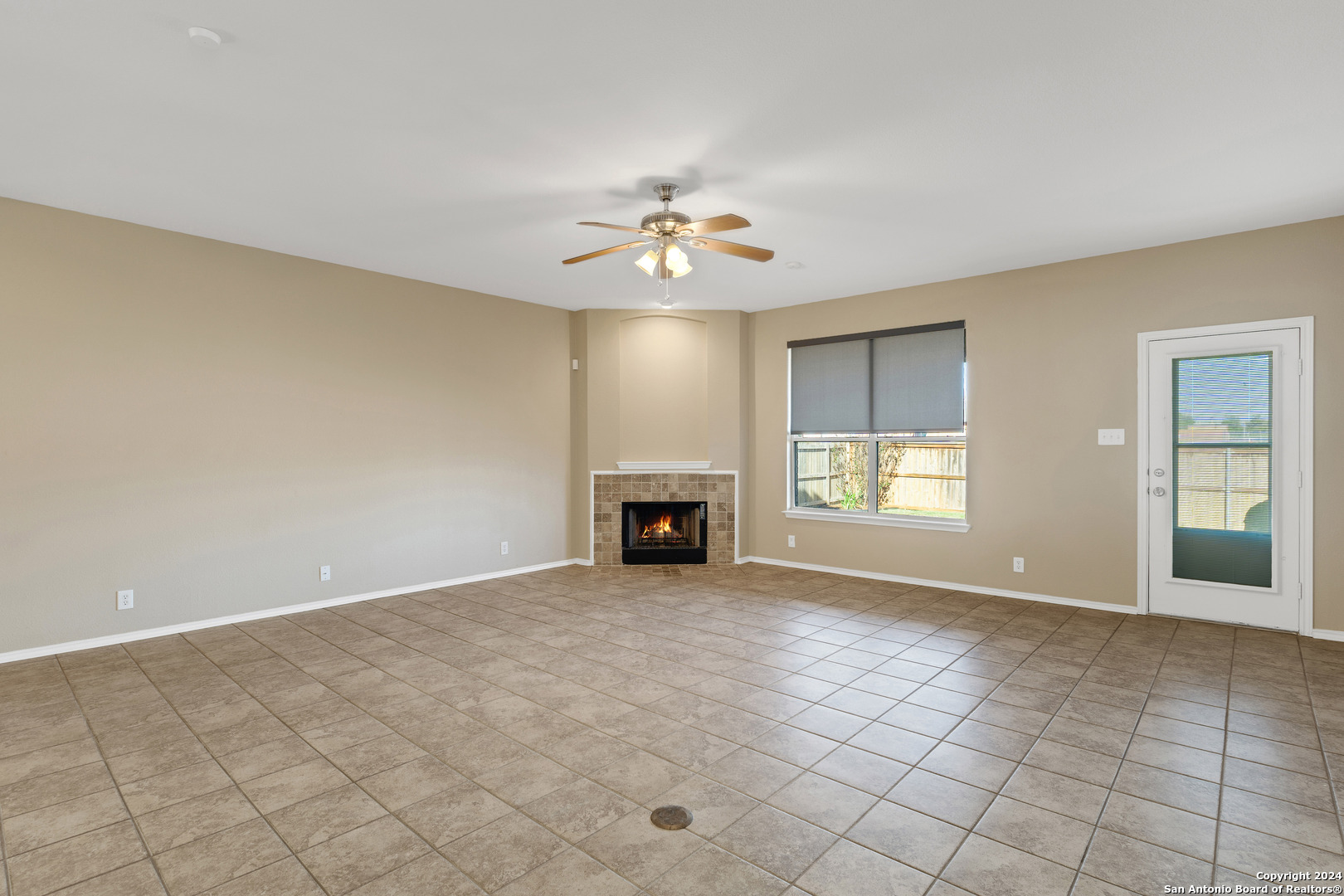 225 Crimson Tree Cibolo, TX 78108 - Photo 4 of 34 an empty room with windows and fireplace
