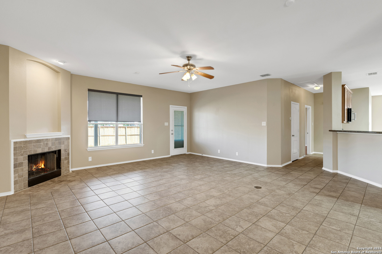225 Crimson Tree Cibolo, TX 78108 - Photo 6 of 34 an empty room with windows and fireplace