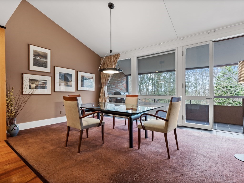 241 Perkins Street, Unit A602 Boston, MA 02130 - Photo 11 of 24 a view of a dining room with furniture window and wooden floor