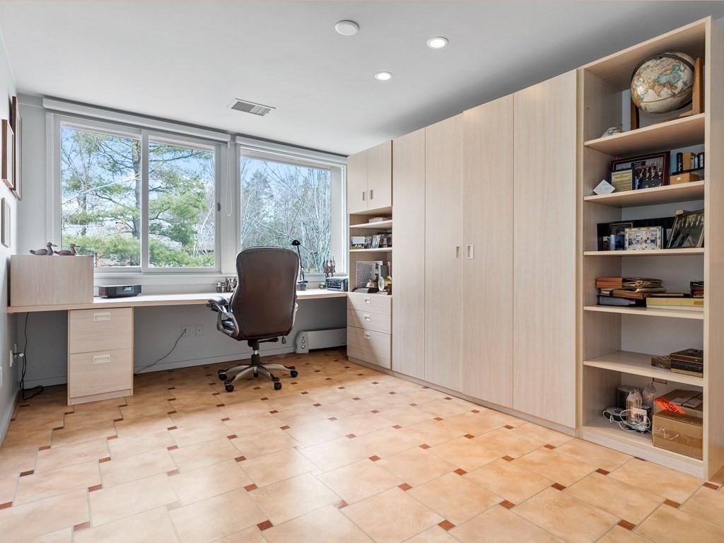 241 Perkins Street, Unit A602 Boston, MA 02130 - Photo 15 of 24 a workspace with furniture and a window