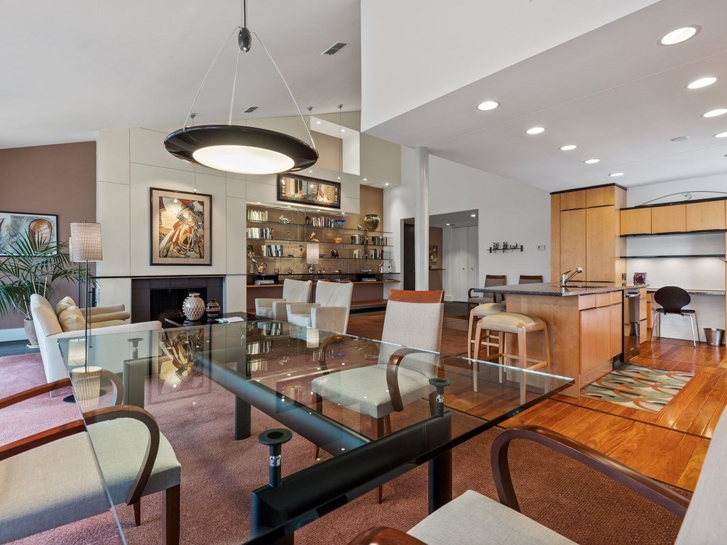 241 Perkins Street, Unit A602 Boston, MA 02130 - Photo 5 of 24 a living room with fireplace furniture and a large window
