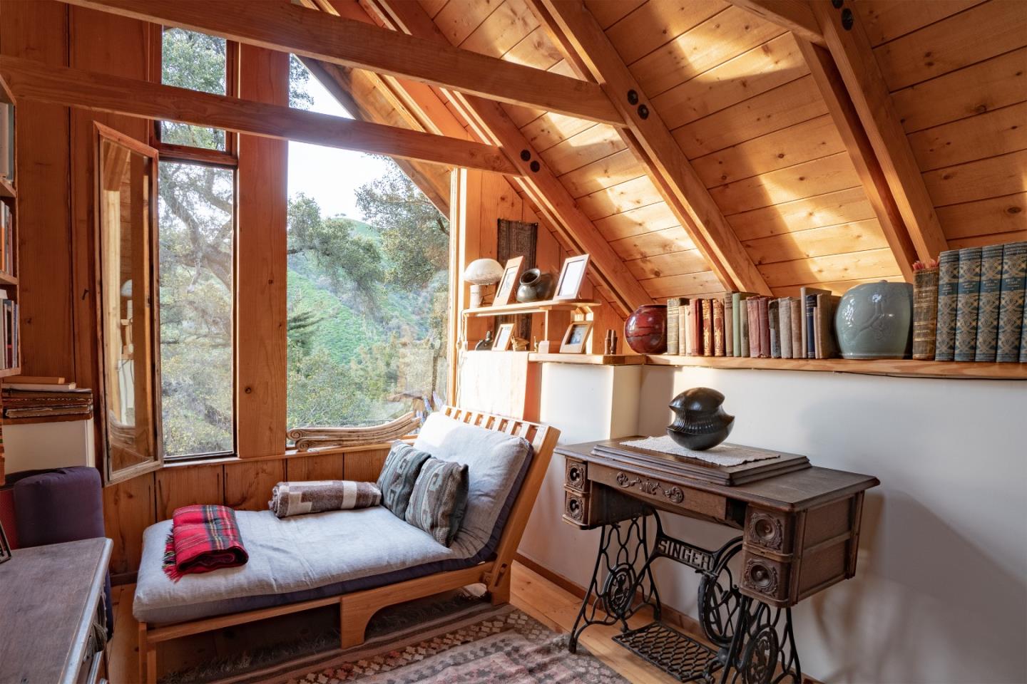 37763 Palo Colorado Road Carmel, CA 93923 - Photo 13 of 32 a living room with furniture a rug and a large window