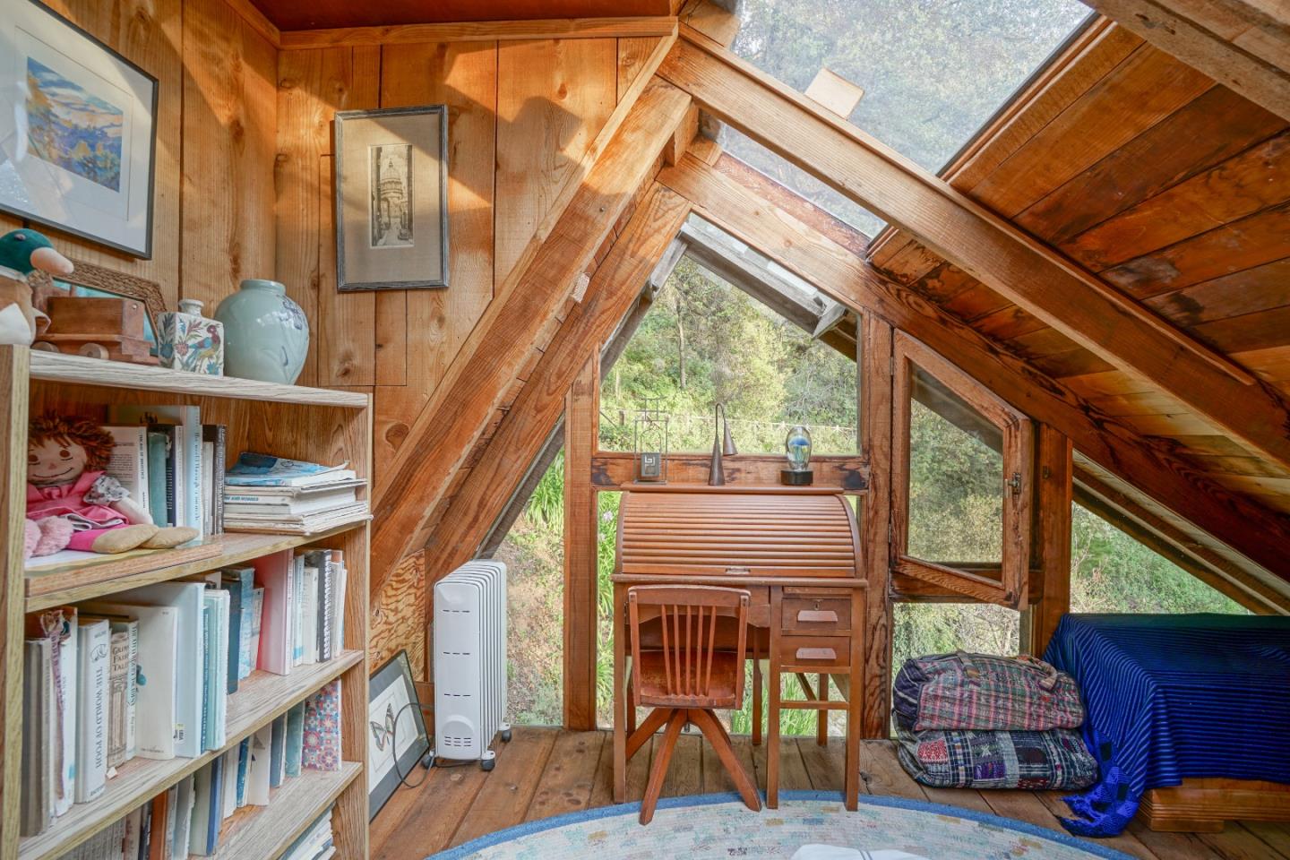37763 Palo Colorado Road Carmel, CA 93923 - Photo 16 of 32 a living room view with furniture and a book shelf