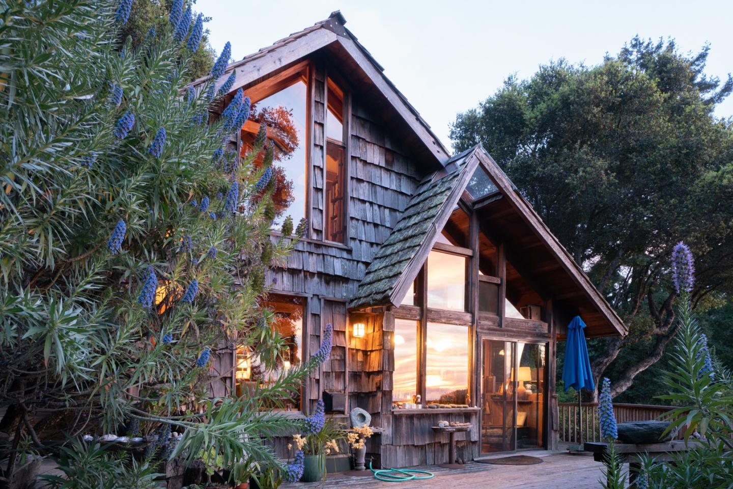 37763 Palo Colorado Road Carmel, CA 93923 - Photo 3 of 32 a view of house with a large windows and a flower garden