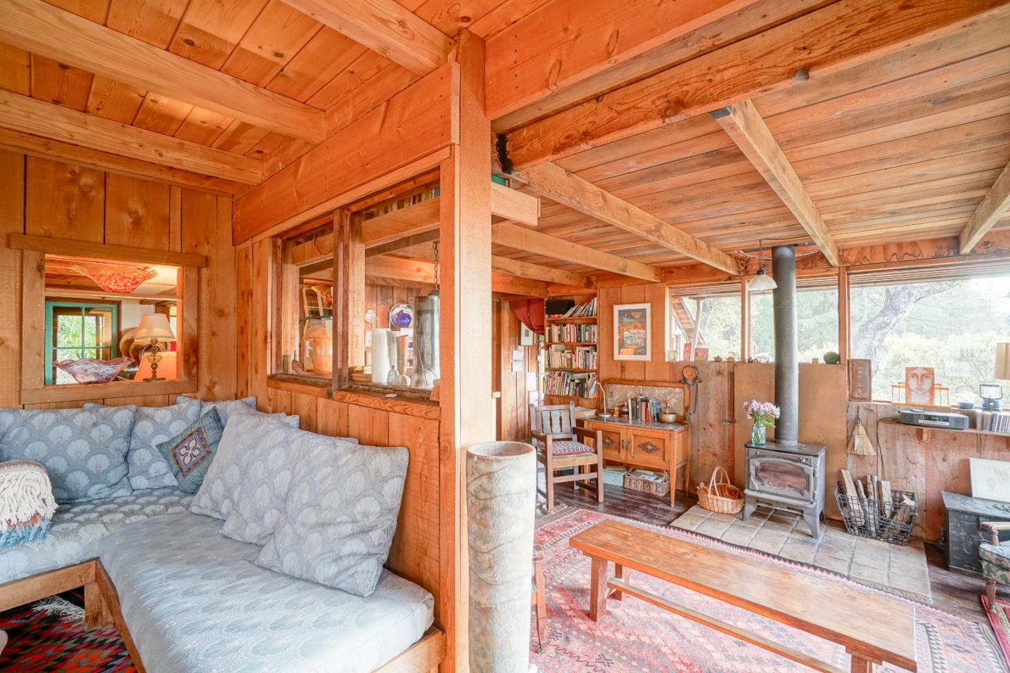 37763 Palo Colorado Road Carmel, CA 93923 - Photo 6 of 32 a living room with furniture and a floor to ceiling window