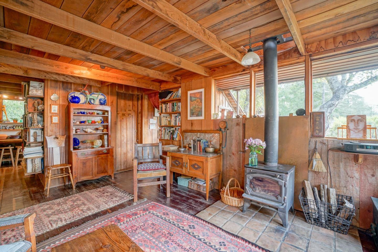 37763 Palo Colorado Road Carmel, CA 93923 - Photo 7 of 32 a room with lots of wooden furniture and a rug