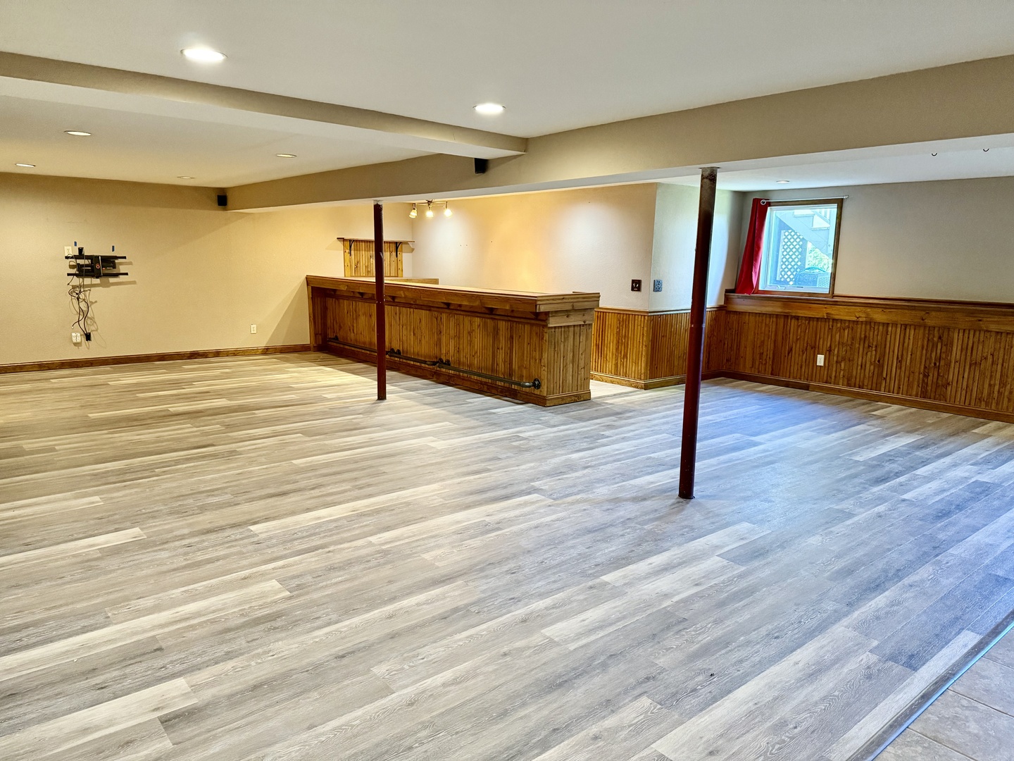 317 Plymouth Court Sycamore, IL 60178 - Photo 11 of 18 a view of an empty room with wooden floor and windows