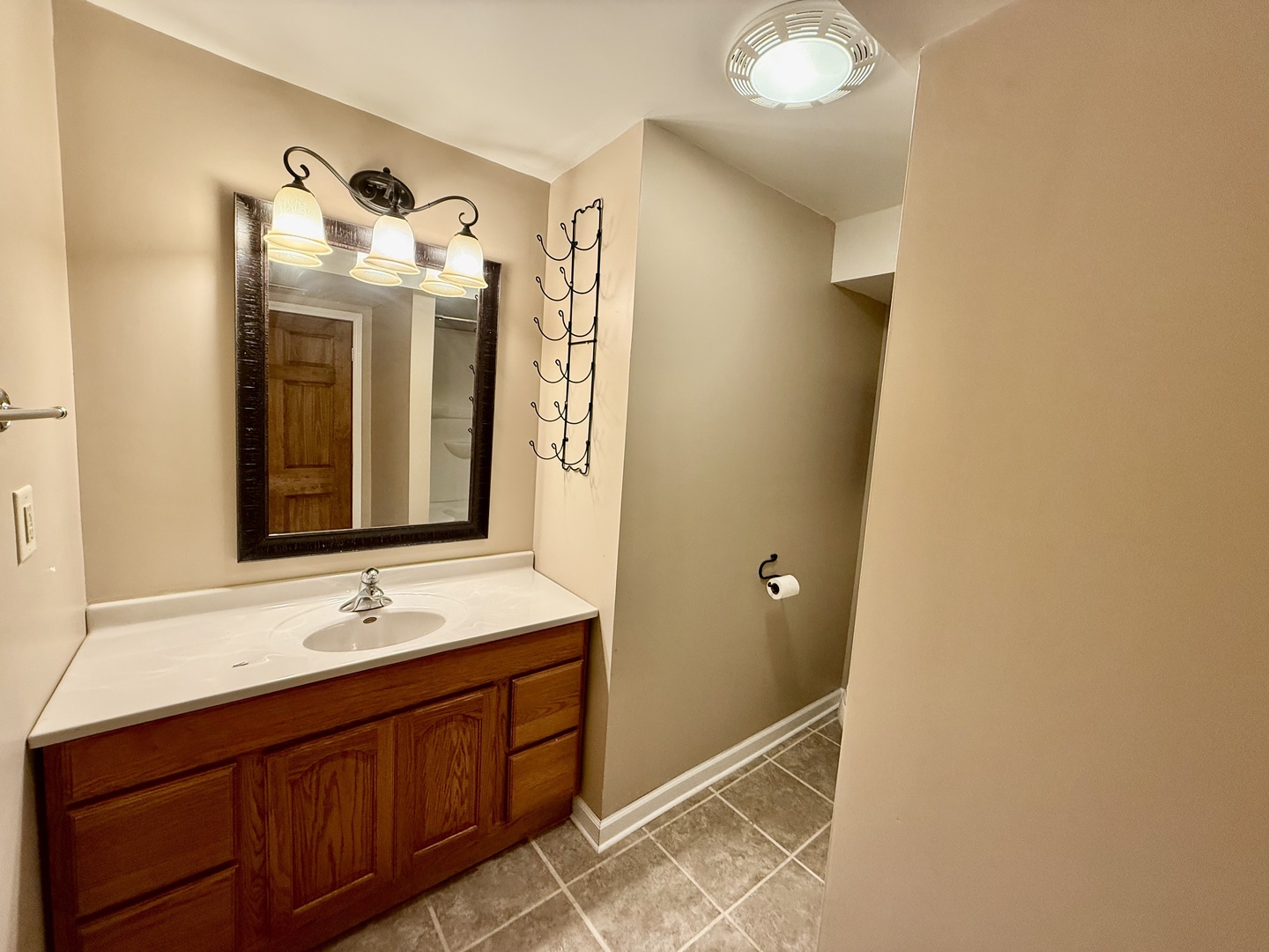 317 Plymouth Court Sycamore, IL 60178 - Photo 14 of 18 a bathroom with a double vanity sink and a mirror