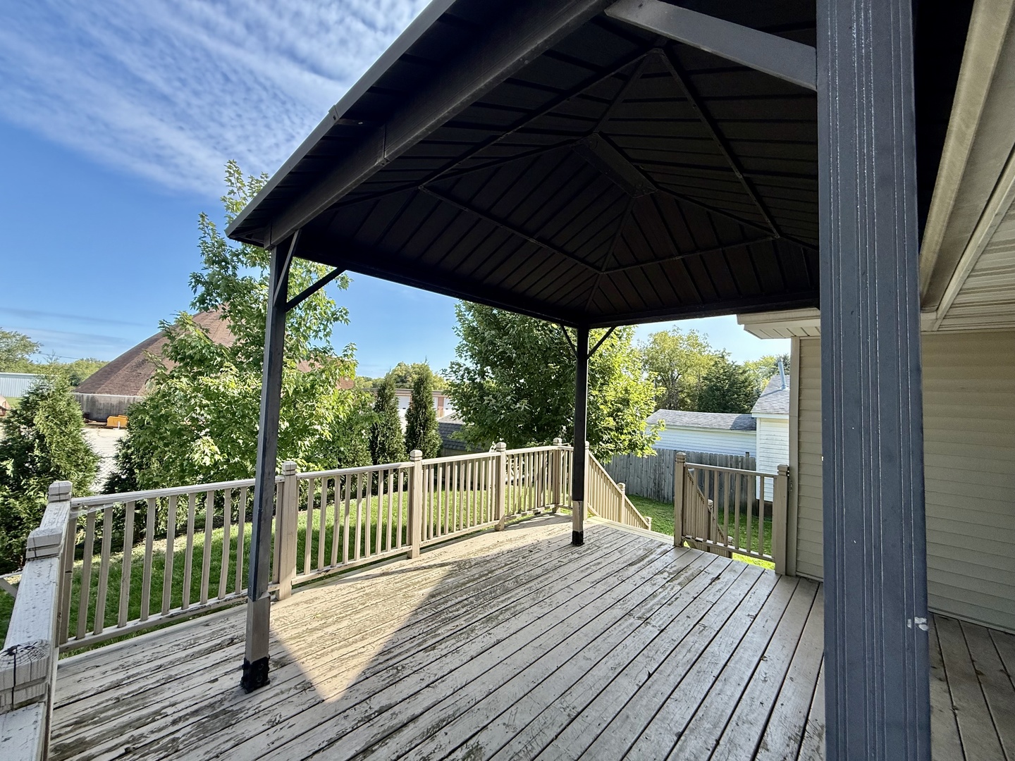 317 Plymouth Court Sycamore, IL 60178 - Photo 16 of 18 a view of a deck with wooden floor and wooden floor