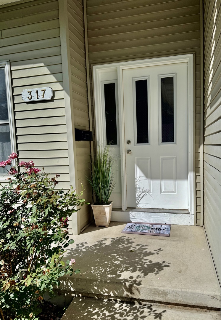 317 Plymouth Court Sycamore, IL 60178 - Photo 17 of 18 a front view of a house with garden