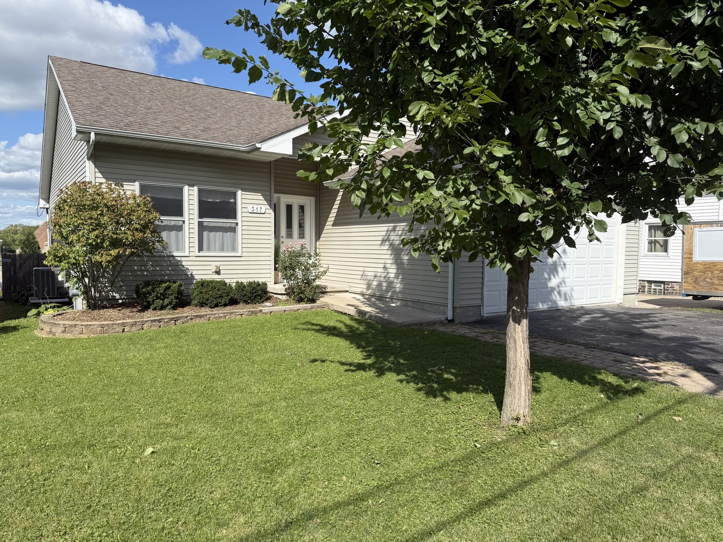 317 Plymouth Court Sycamore, IL 60178 - Photo 18 of 18 a house view with a garden space