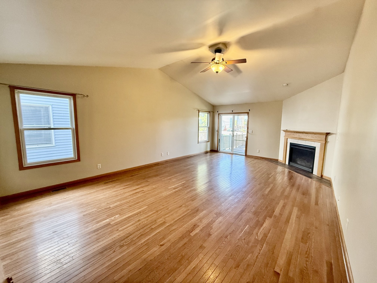 317 Plymouth Court Sycamore, IL 60178 - Photo 4 of 18 a view of an empty room with wooden floor and fan