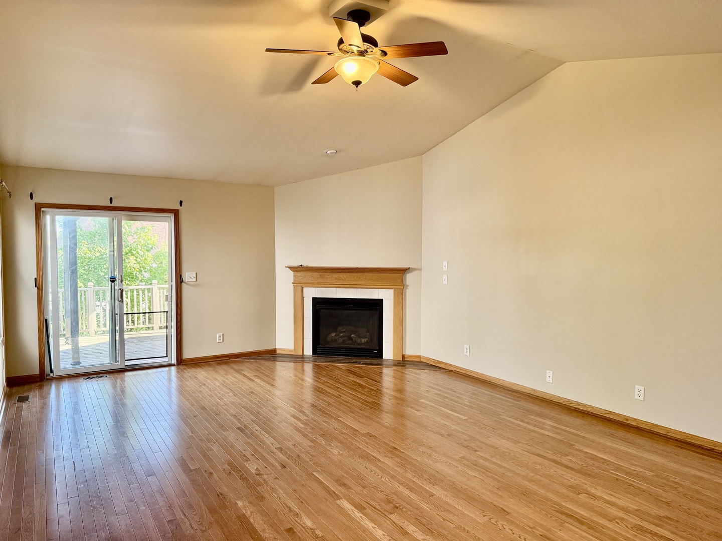 317 Plymouth Court Sycamore, IL 60178 - Photo 5 of 18 an empty room with wooden floor fan and windows