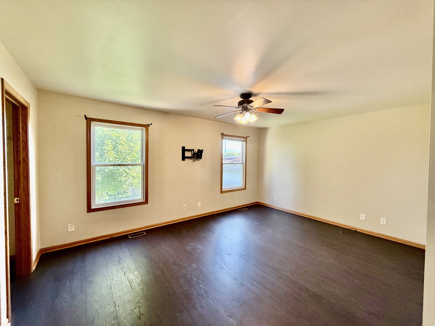 317 Plymouth Court Sycamore, IL 60178 - Photo 6 of 18 a view of a livingroom with wooden floor and a ceiling fan