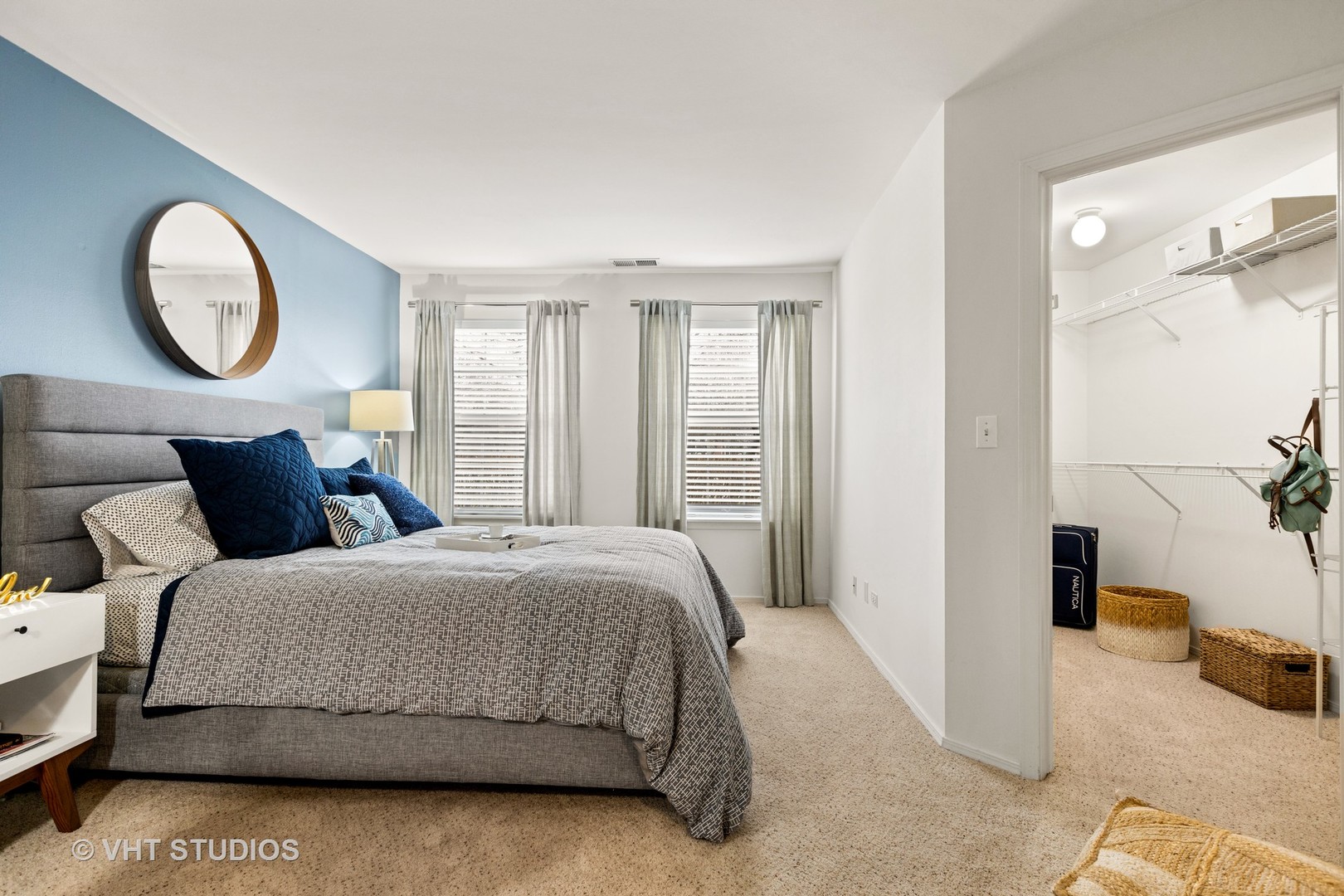 1711 Buttonwood Circle, Unit 2821 Schaumburg, IL 60173 - Photo 12 of 27 a bedroom with a bed a mirror and a window