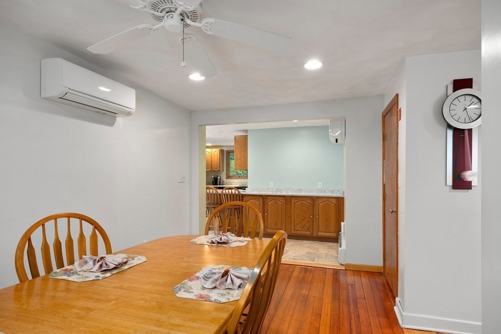 102 Orange Street Reading, MA 01867 - Photo 6 of 23 a bedroom with a bed and wooden floor