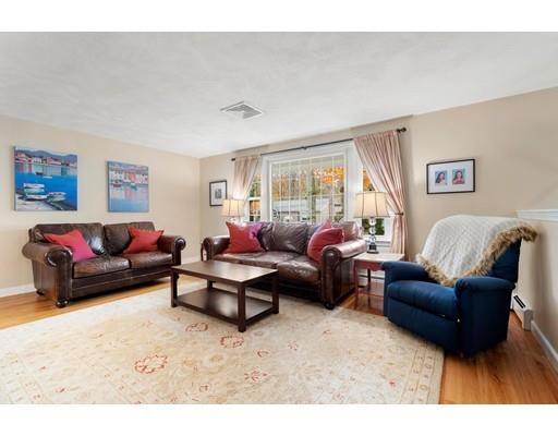 10 Hemlock Road Reading, MA 01867 - Photo 19 of 42 a living room with furniture a couch and a window