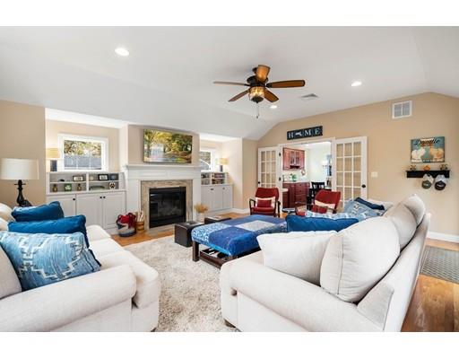 10 Hemlock Road Reading, MA 01867 - Photo 23 of 42 a living room with furniture and a fireplace