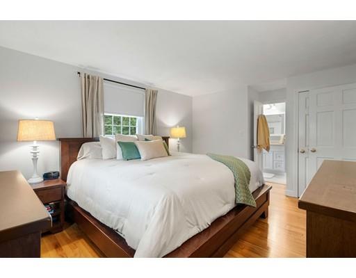 10 Hemlock Road Reading, MA 01867 - Photo 24 of 42 a bedroom with a bed and a night stand