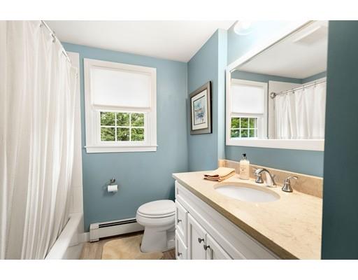 10 Hemlock Road Reading, MA 01867 - Photo 26 of 42 a bathroom with a granite countertop toilet sink and mirror