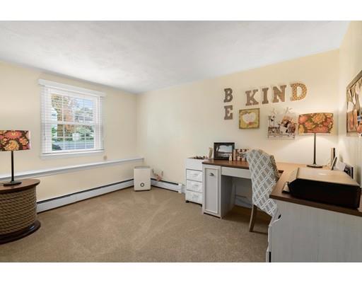 10 Hemlock Road Reading, MA 01867 - Photo 31 of 42 a living room with furniture and a window