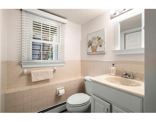 10 Hemlock Road Reading, MA 01867 - Photo 32 of 42 a bathroom with a toilet sink and mirror