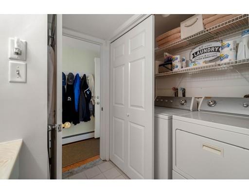 10 Hemlock Road Reading, MA 01867 - Photo 33 of 42 a view of walk in closet with clothes and shoes