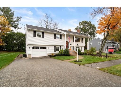 10 Hemlock Road Reading, MA 01867 - Photo 5 of 42 a view of a house with a yard and large trees